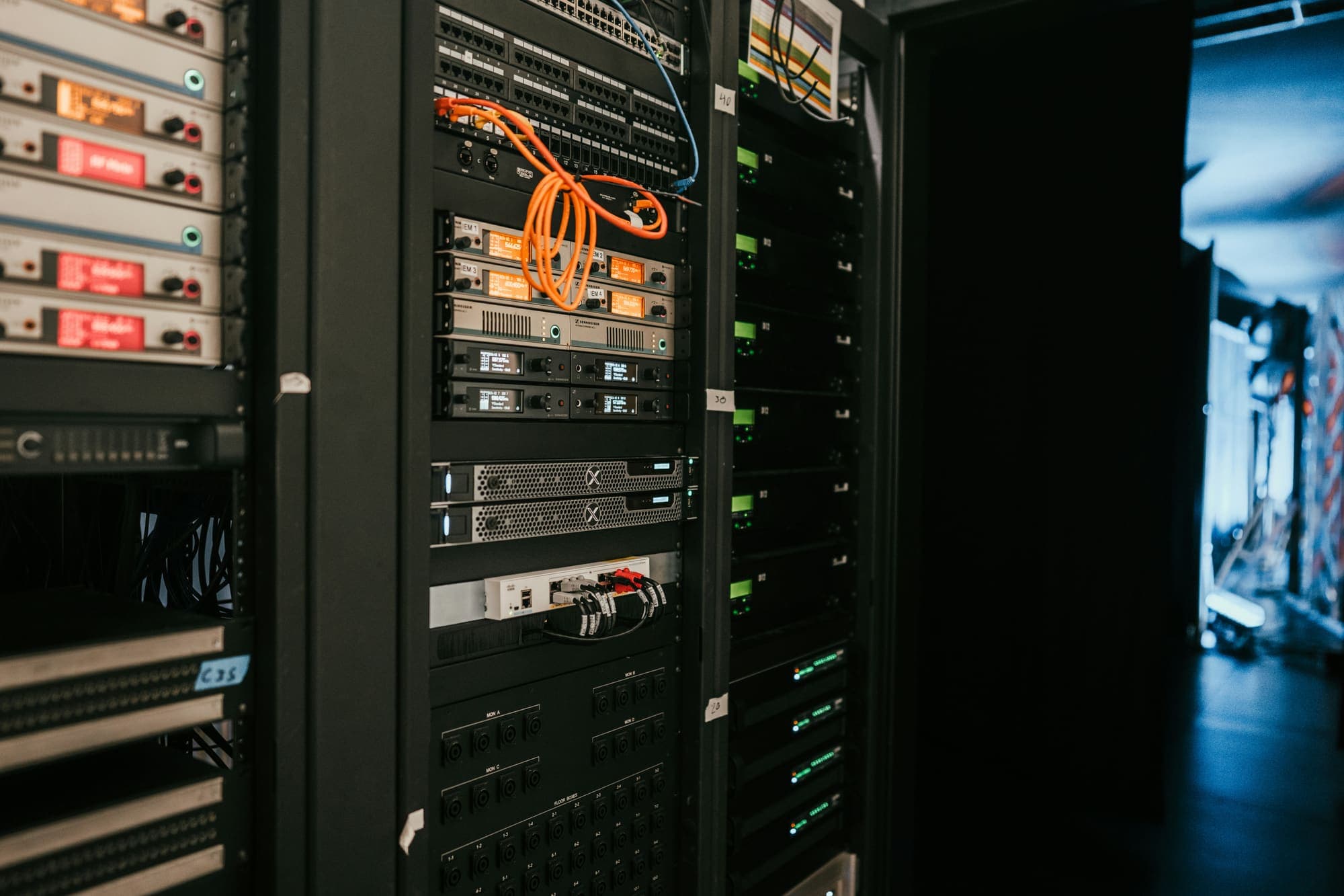 Network rack with patch panels, structured cabling, and rack-mounted equipment